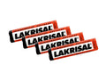 4 x Lakrisal 25g – four red and black Lakrisal rolls fanned out on a white background, LAKRISAL lettering in bold black, Salmiaksnoepjes RBV Leaf branding, strong Scandinavian salmiak licorice pastilles, 100g total
