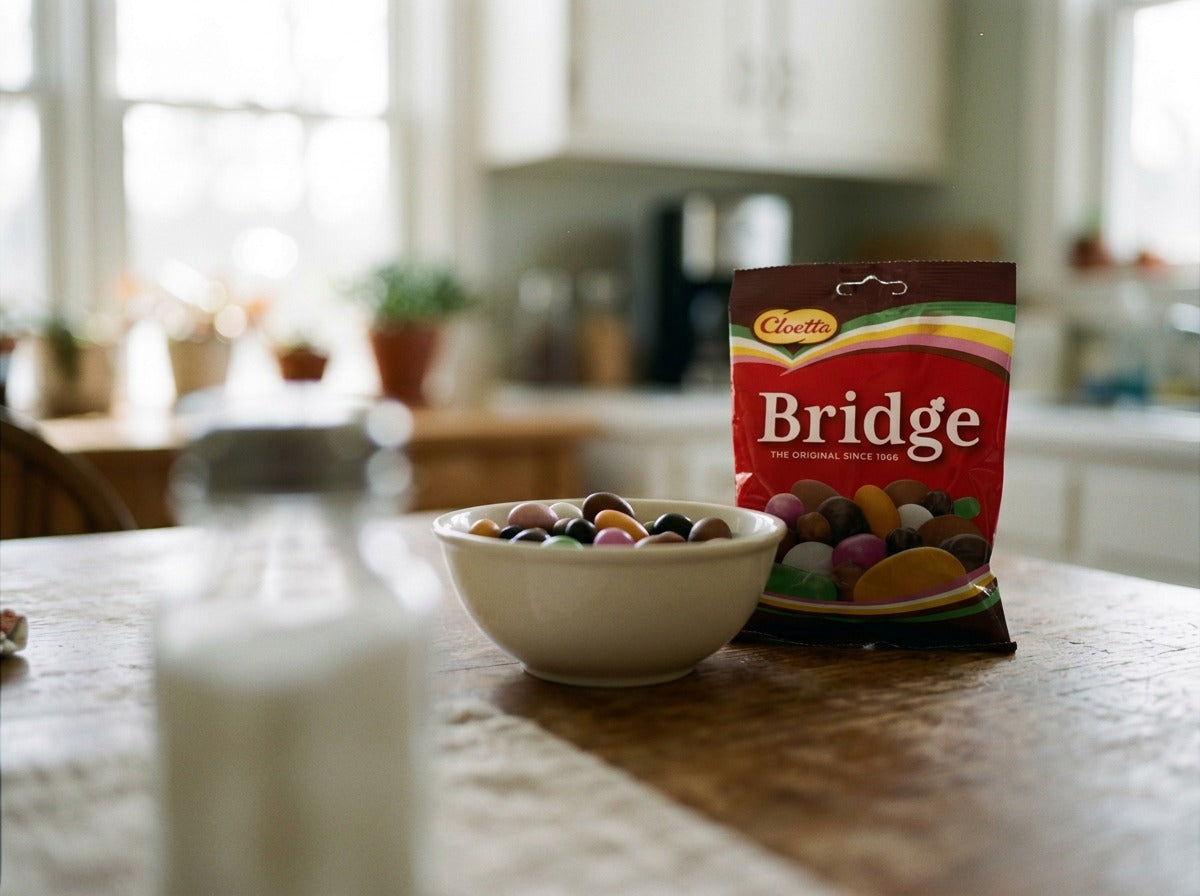 Cloetta Bridge Original 180g open bag showing mixed Swedish candy varieties including chocolate, nuts and licorice
