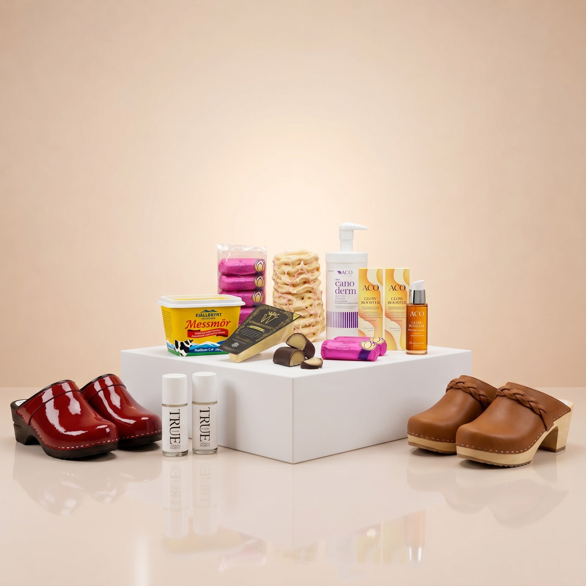 Swedish new arrivals display featuring ACO skincare, Canoderm, Messmor, Swedish clogs, True nail polish and premium chocolate on a white podium – Swedish Cravings